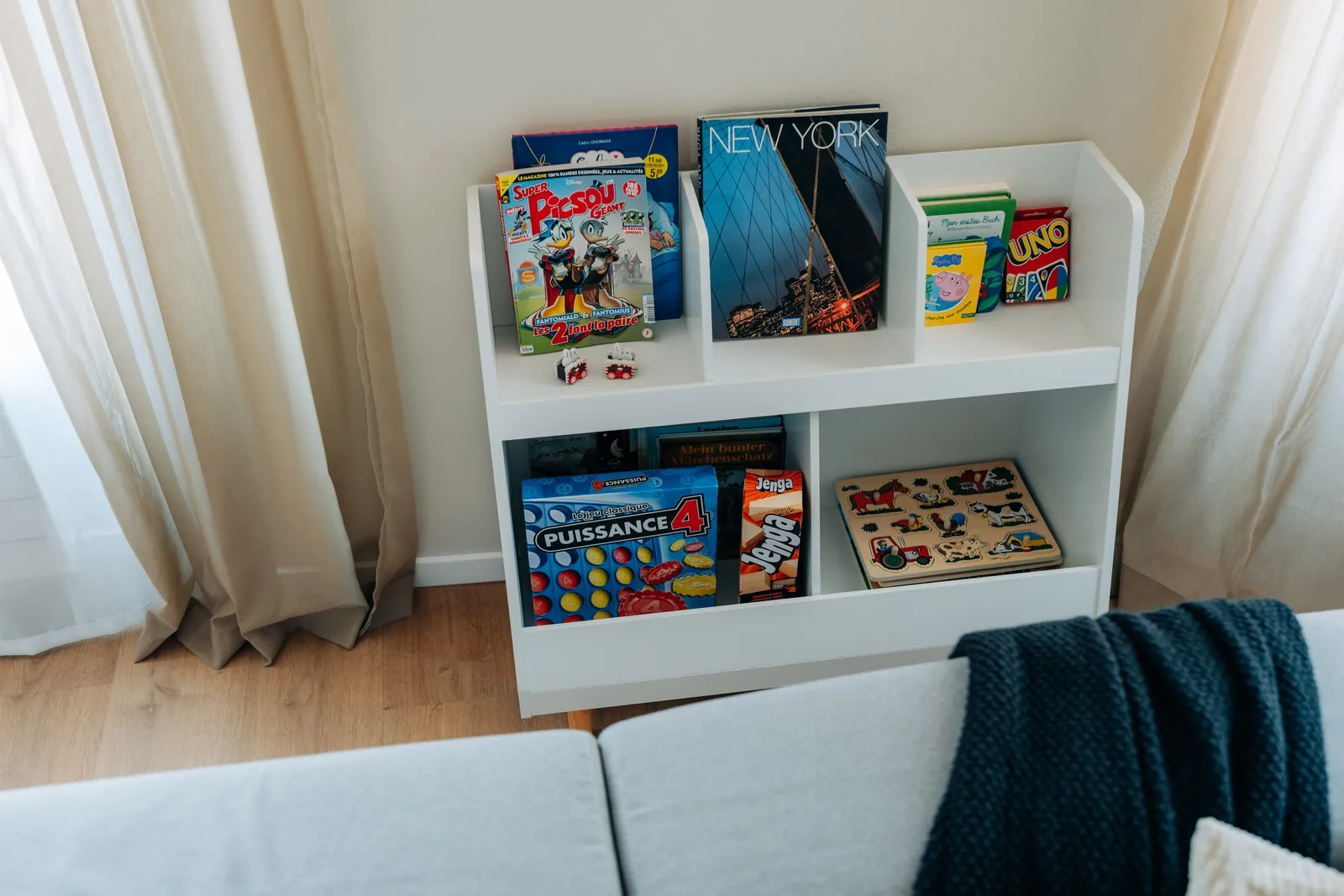 Kinderecke mit Büchern und Spielen in der Wohnung Central Suite One